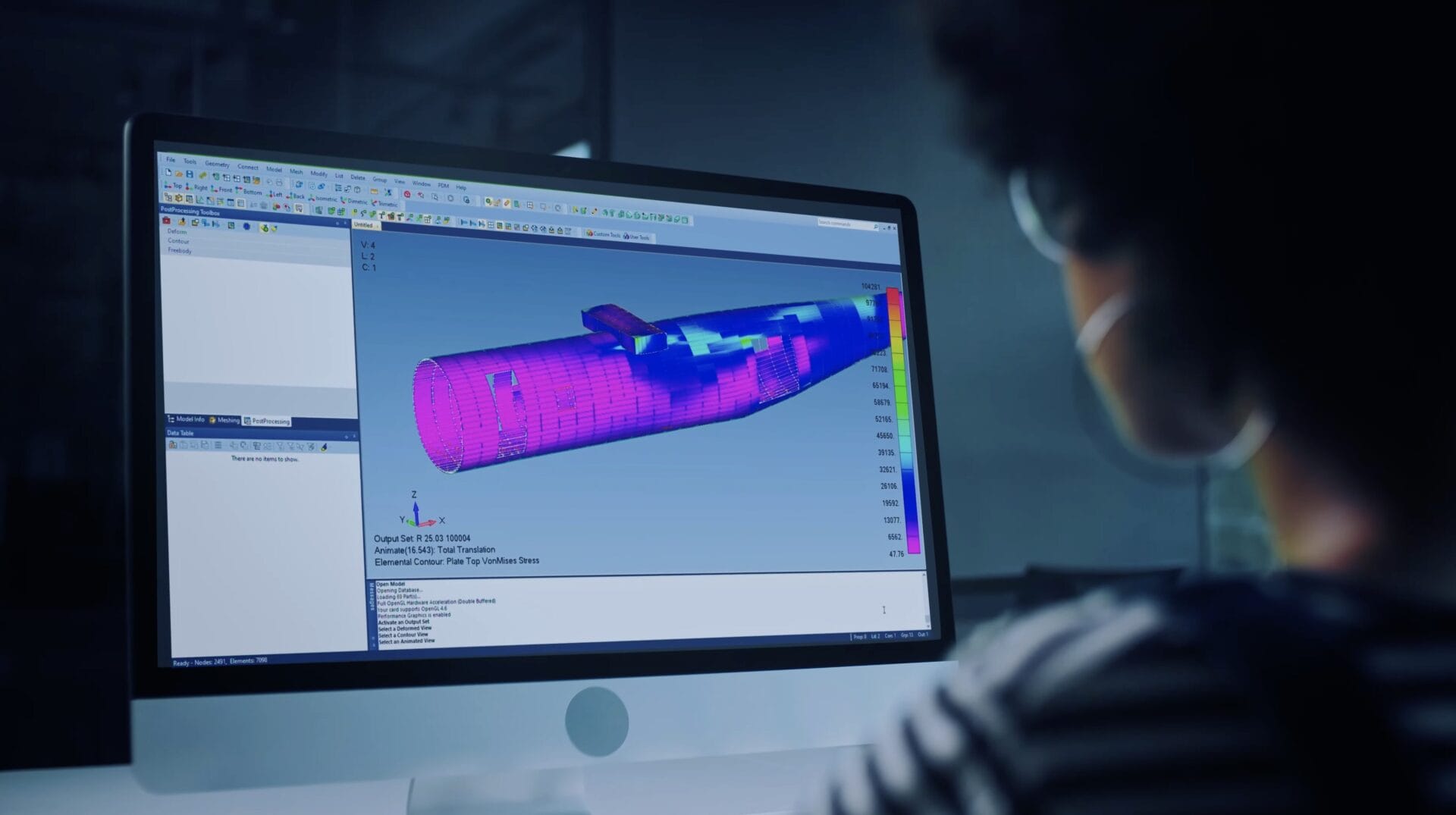Woman using computer to edit aerospace CAD